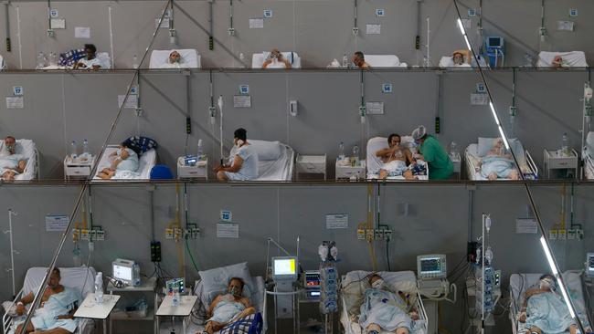 Patients affected by coronavirus at a field hospital set up at a sports gym, in Sao Paulo, Brazil. If the virus did leak it will add spectacular incompetence and reckless disregard for safety to a pattern of lies, manipulation and cover-ups; all of which have cost the world unparalleled human and economic damage. Picture: AFP