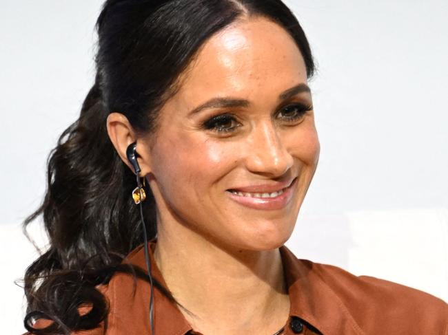 American actress Meghan Markle smiles during the 'Responsible Digital Future' forum in Bogota on August 15, 2024. Prince Harry and his wife, American actress Meghan Markle, arrived in Colombia at the invitation of Marquez, with whom they will attend various meetings with women and young people to reject discrimination and cyberbullying. (Photo by Raul ARBOLEDA / AFP)