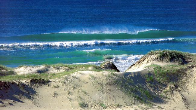 Surf breaks on beach near Couran Cove Resort on South Stradbroke Island. Queensland. Travel