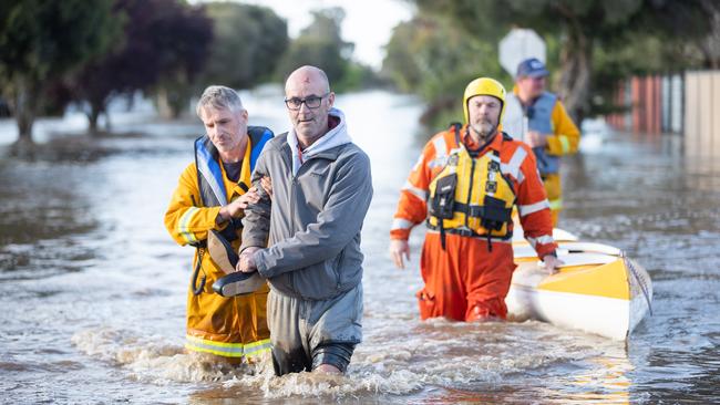 The small town of Rochester on the Campaspe River prepares for rising flood waters with sand bagging and waterproofing of shopfronts and houses. Picture: Jason Edwards