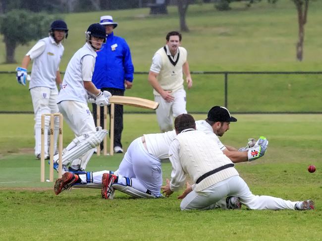 Crib Point’s Waide Symes goes at Long Island, finding an edge from the bat of Kyle O’Reilly. Picture: Luis Enrique Ascui