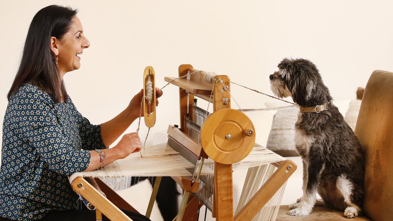 Dalia Holsman with Winston weaves pet fur into cushions. Picture: David Caird.