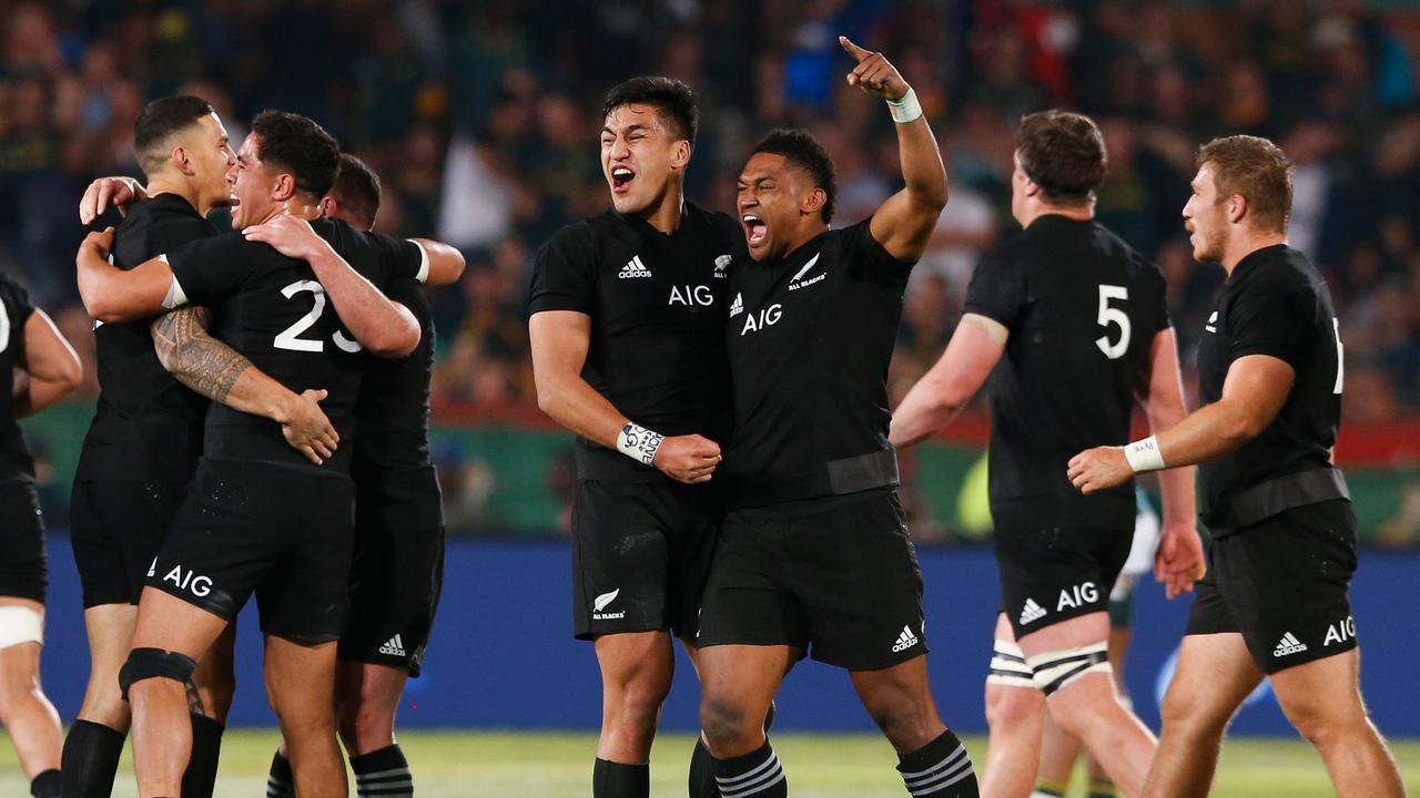 New Zealand players celebrate after winning the Rugby Championship match.