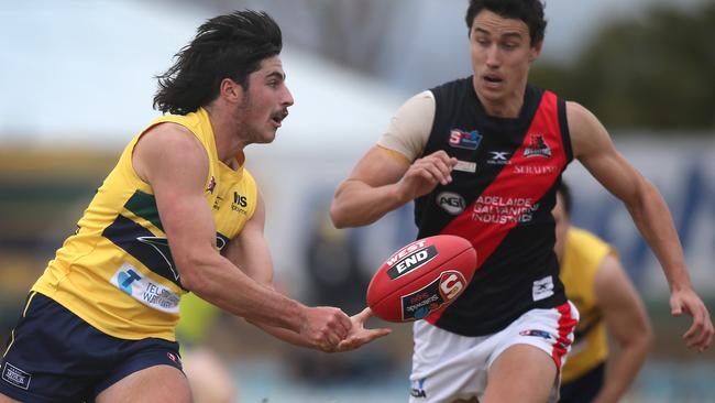 Lachlan Jones wins possession in front of West’s Tom Keough. Picture: Dean Martin.