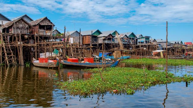 Simple bamboo houses built in the water of Tonle Sap Lake near Siem Reap in Cambodia.