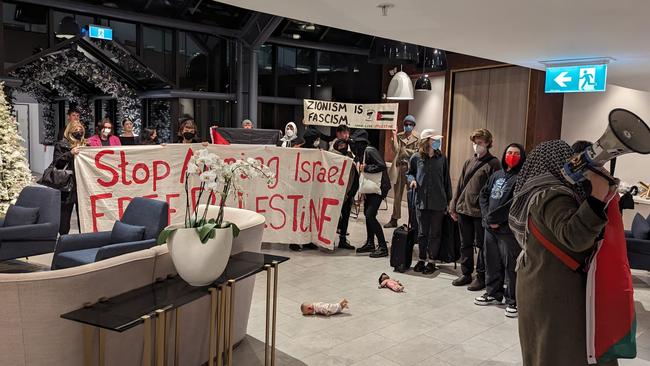 Pro-Palestinian activists have sparked outrage after they ambushed visiting friends and families of Israeli hostages at the Melbourne hotel they were staying at.