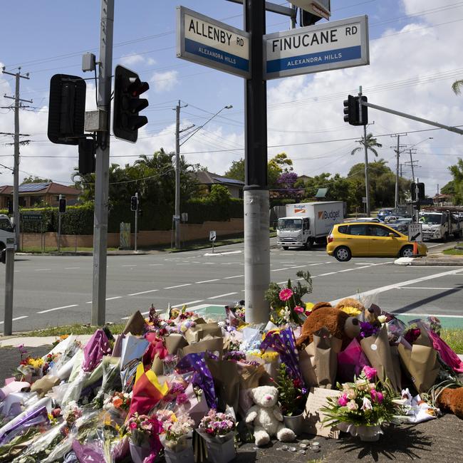 The intersection of Vienna and Finucane roads in Alexandra Hills filled with flowers and presents from the public. Picture: NCA NewsWire / Sarah Marshall