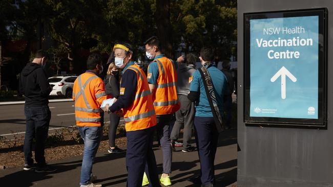 People queue at a vaccination hub in Sydney. Picture: Getty Images