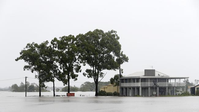 The flooded Hawkesbury River rising closer to a home on Wilberforce Rd in Wilberforce. Picture: Jonathan Ng