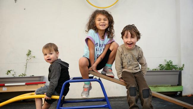 Eddie, Winnie and Jack at childcare, where they are taught how to blow their noses. Picture: Richard Dobson