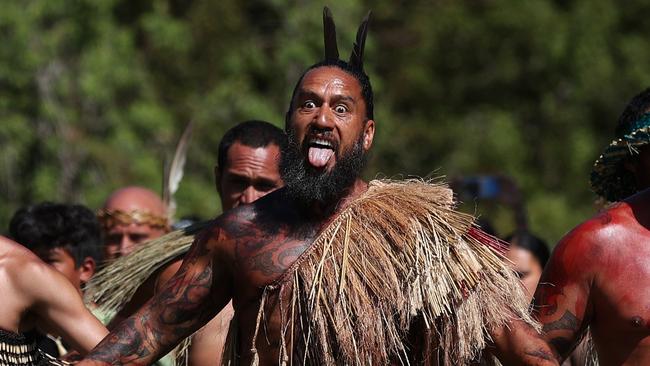 Maori warriors prepare to welcome the New Zealand government representatives including Prime Minister Christopher Luxon at Waitangi. Picture: Getty Images.