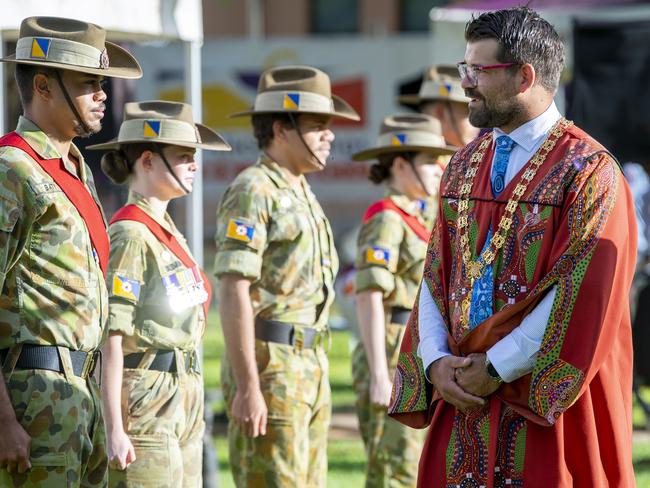 Alice Springs Mayor Matt Paterson inspects the honour guard during the Australia Day flag raising and citizenship ceremony on the council lawns. Picture Mark Brake