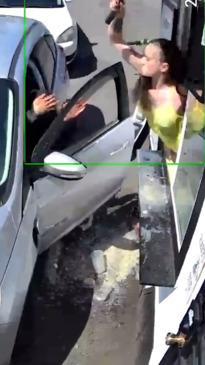 Bikini-clad barista smashes customers windshield