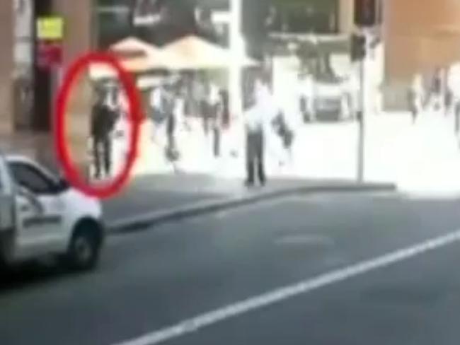 Man Monis walking around Martin Place to the Lindt Cafe / Picture: Channel 7