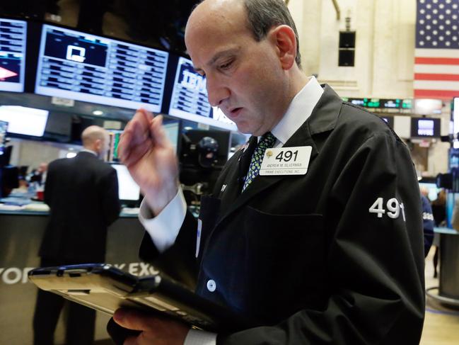 Trader Andrew Silverman works on the floor of the New York Stock Exchange, Monday, Jan. 11, 2016. U.S. stocks are opening higher as the market shakes off the latest drop in China. (AP Photo/Richard Drew)