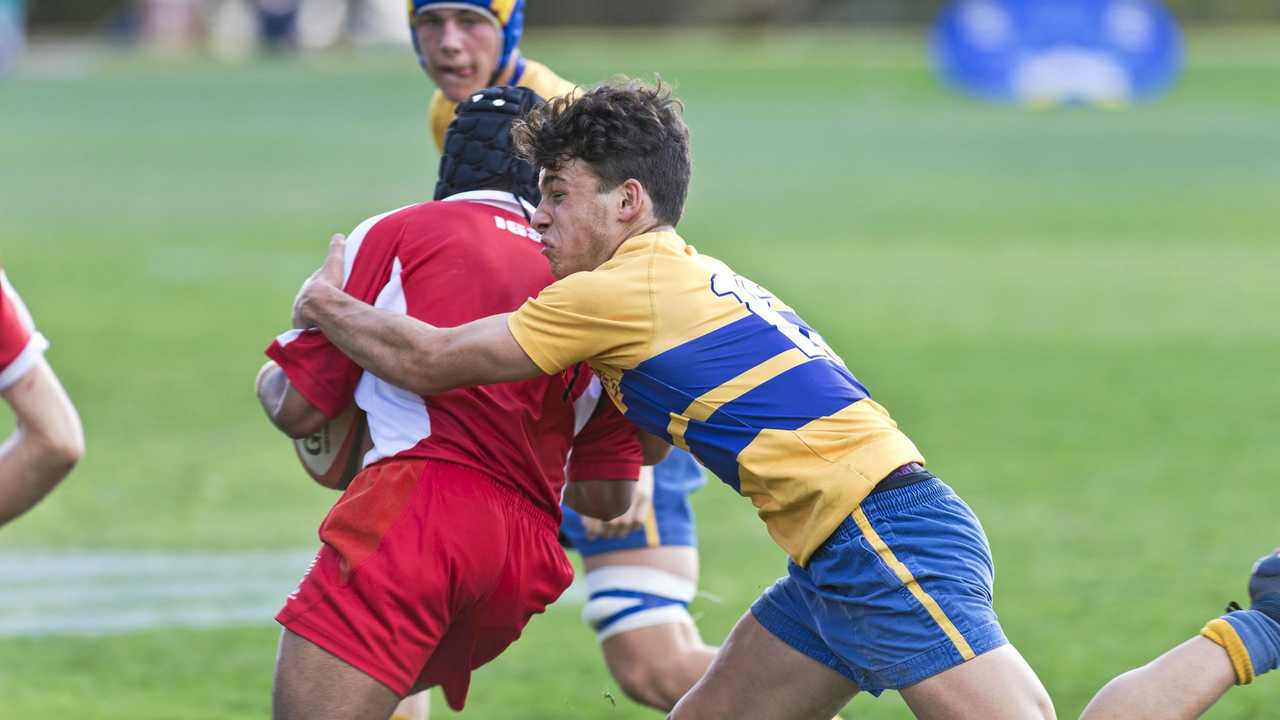 SOLID DEFENCE: Toowoomba Grammar School player Jacob Burgoyne wraps up his Ipswich opponent during their match last weekend. Picture: Kevin Farmer