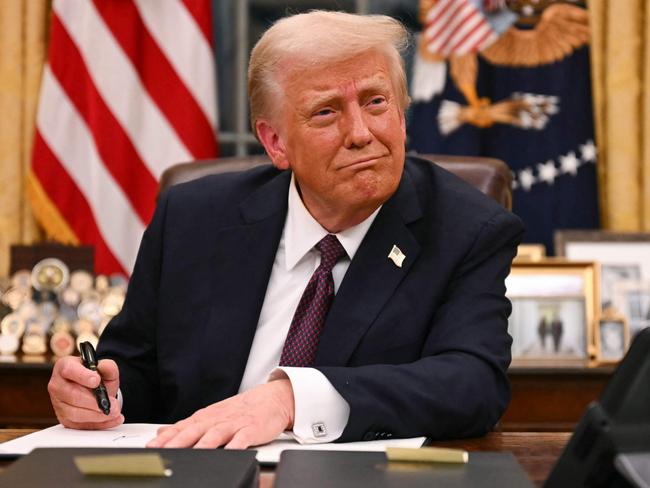 US President Donald Trump signs executive orders in the Oval Office of the White House in Washington, DC, on January 20, 2025. Picture: NewsWire / Jim WATSON / POOL / AFP