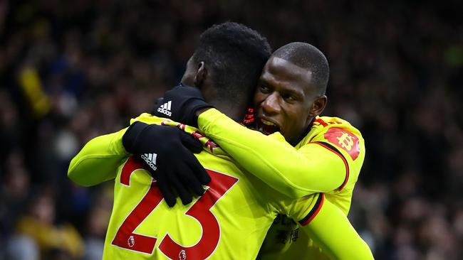 Ismaila Sarr of Watford celebrates after scoring his team's first goal with teammate Abdoulaye Doucoure.