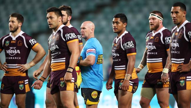 Broncos trainer Allan Langer gives the troops a rev up on Friday night. Picture: Brett Costello