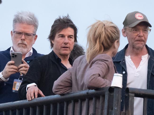 Tom Cruise (second from left) and Simon Pegg (R) ahead of Coldplay performing during day four of last year’s Glastonbury Festival. Picture: Samir Hussein/WireImage