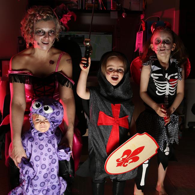 Cate Parsons and her three girls Faith, Storm and Hunter. Cate has organised an online community in previous years where you could list your home on the map if you are being part of Halloween. Picture: George Salpigtidis