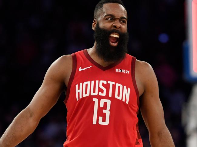 James Harden #13 of the Houston Rockets celebrates the 114-110 over the New York Knicks at the end of the game at Madison Square Garden on January 23, 2019 in New York City. - James Harden took his high-scoring act to Madison Square Garden on Wednesday where he dazzled his way to a season-high 61-points as the Houston Rockets edged the hapless New York Knicks 114-110. (Photo by Sarah Stier / GETTY IMAGES NORTH AMERICA / AFP)