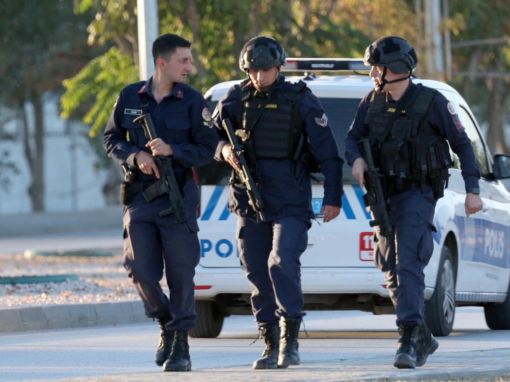 Armed Turkish Gendermerie officers walk along the main throughfare in Kahramankazan, some 40 kilometers outside of Ankara after a huge explosion was heard. Picture: Adem ALTAN / AFP