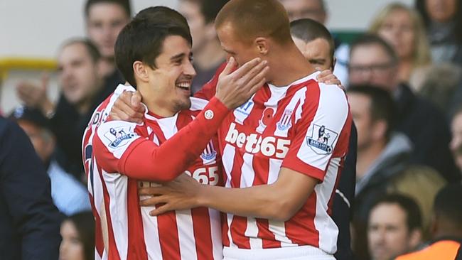 Bojan Krkic (L) of Stoke City celebrates with teammate Steve Sidwell.