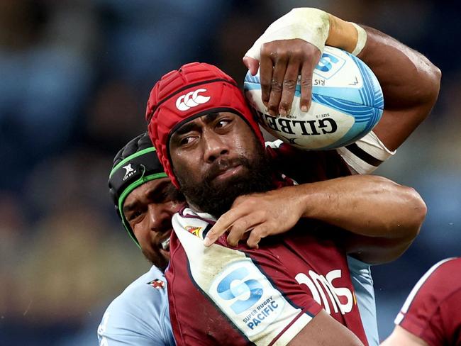 Redsâ Seru Uru (R) is tackled by Waratahs' Jay Fonokalafi (L) during the Super Rugby match between the New South Wales Waratahs and Queensland Reds at the Allianz Stadium in Sydney on May 31, 2024. (Photo by DAVID GRAY / AFP) / -- IMAGE RESTRICTED TO EDITORIAL USE - STRICTLY NO COMMERCIAL USE --