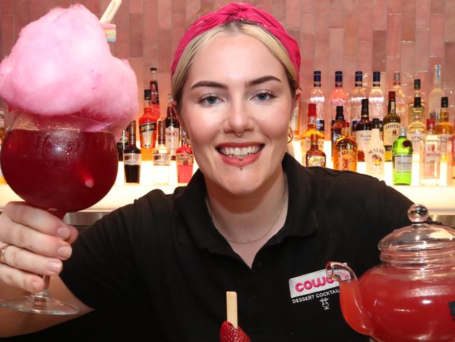 Venue Manager Tarsh Goodwin with some of what's on offer at the new Cowch opening at Oracle Boulevard in Broadbeach. Picture Glenn Hampson