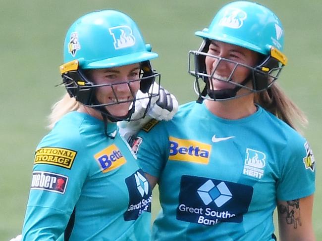 ADELAIDE, AUSTRALIA - NOVEMBER 07:  Georgia Redmayne of the Brisbane Heat celebrates after reaching her half century with Mikayla Hinkley of the Brisbane Heat during the Women's Big Bash League match between the Sydney Thunder and the Brisbane Heat at Adelaide Oval, on November 07, 2021, in Adelaide, Australia. (Photo by Mark Brake/Getty Images)