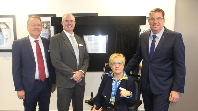 Carers Queensland President Jim Toohey, second from left, says anyone with concerns about Cocoon should have reported to appropriate authorities. Mr Toohey is pictured here with state MP Jim Madden, left, NDIS area manager Fran Vicary and federal MP Scott Buchholz, right, officially opening a new office in Ipswich