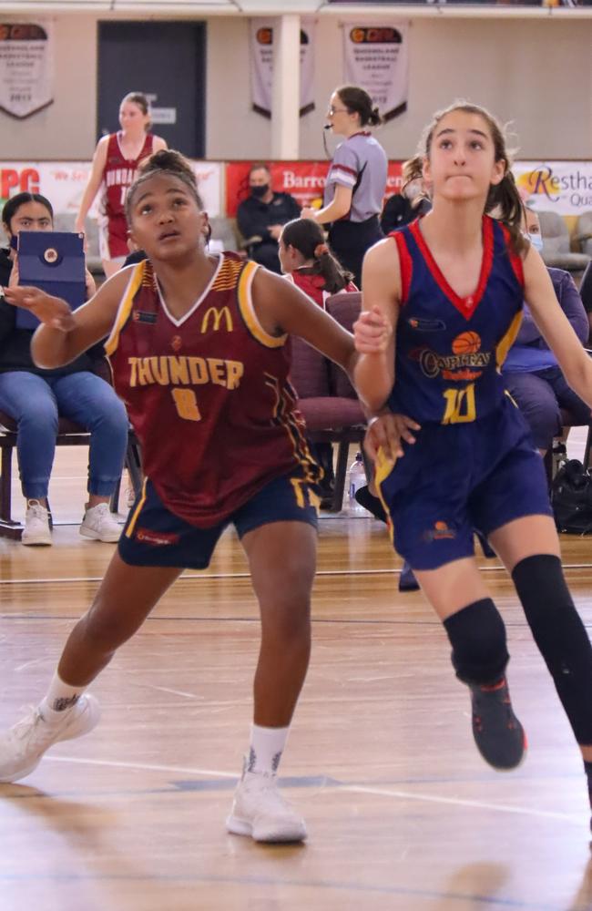 Logan Thunder's Mia Nakata battling it out against Brisbane on day two. Picture: Basketball QLD