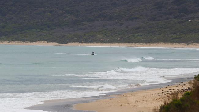 Police on jet skis search O'Donoghues Beach near Anglesea in Victoria. Picture: AAP Image/David Crosling.