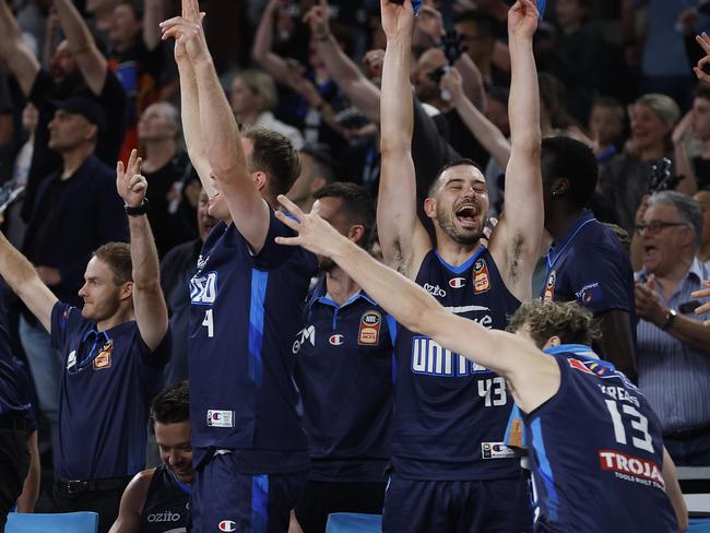 MELBOURNE, AUSTRALIA - DECEMBER 16: Chris Goulding of United and the team celebrate a three pointer to Campbell Blogg of United before the buzzer after winning the round 11 NBL match between Melbourne United and Adelaide 36ers at John Cain Arena, on December 16, 2023, in Melbourne, Australia. (Photo by Daniel Pockett/Getty Images)