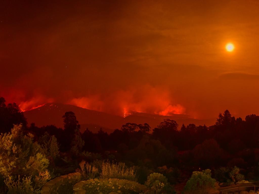 Mt Tomah Botanical Gardens suffered damage from the Gospers Mountain Fire Sunday evening gas it travelled from Mt Wilson east towards Bilpin. Early hours of the morning the fire front can be seen burning out of control in the valleys to the east of the gardens. Picture: Matrix