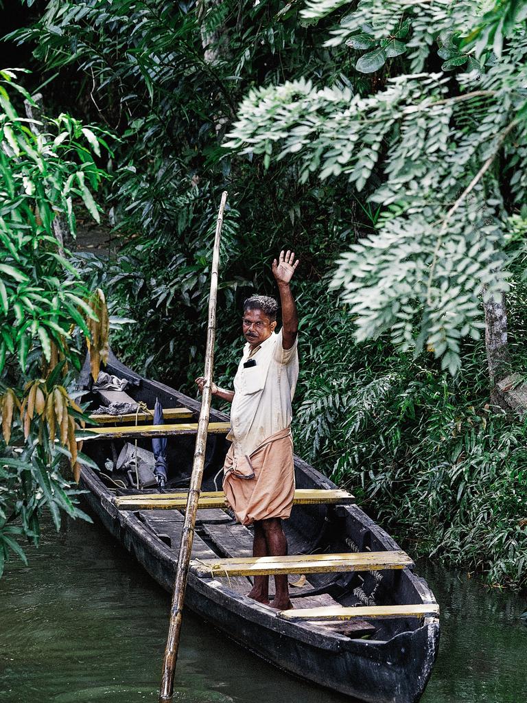 A fisherman in the backwaters of Kochi.