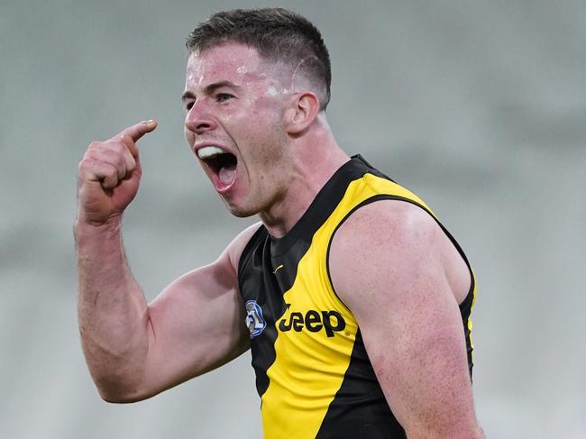 Jack Higgins of the Tigers celebrates a goal during the Round 2 AFL Match between the Collingwood Magpies and Richmond Tigers at the Melbourne Cricket Ground in Melbourne, Thursday, June 11, 2020. (AAP Image/Michael Dodge) NO ARCHIVING, EDITORIAL USE ONLY