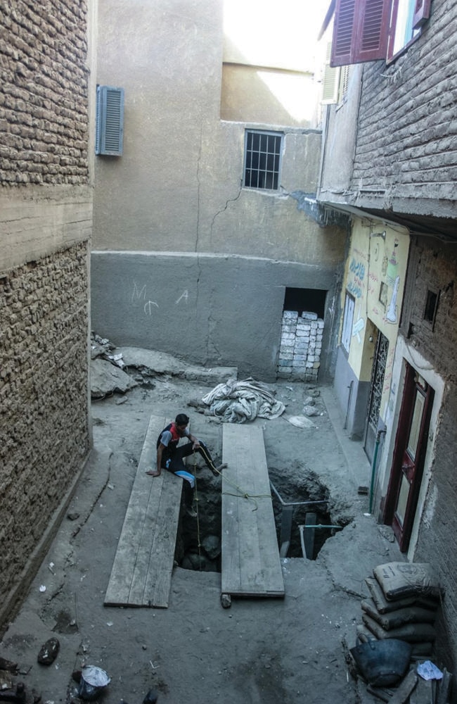 Road works ... the full scale of the collapse — and the tightness of the suburban setting — is evident in this picture from the Luxor Times.