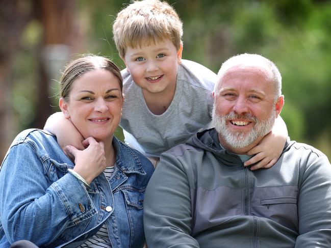 Xavier with his parents Hayley and Rodney Grant. Picture: David Caird