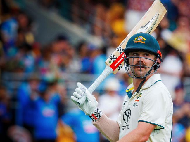 Australia's Travis Head acknowledges the crowd as he departs after being dismissed by India's Jasprit Bumrah on day two of the third cricket Test match between Australia and India at The Gabba in Brisbane on December 15, 2024. (Photo by Patrick HAMILTON / AFP) / -- IMAGE RESTRICTED TO EDITORIAL USE - STRICTLY NO COMMERCIAL USE --