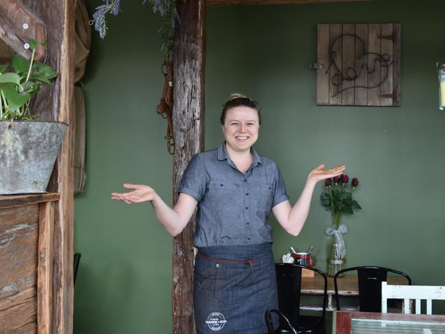 Sharla Watson in the new, renovated Farmer and Sun Cafe, which offers more space and an eclectic, rustic, vintage vibed decor.