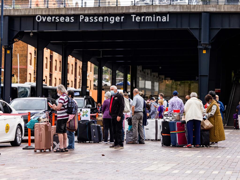 Celebrity Eclipse passengers wait for transportation from Circular Quay after the Covid-infested cruise ship docked on Friday morning. Picture: NCA NewsWire / Ben Symons