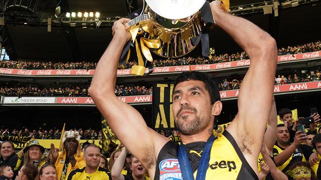 Marlion Pickett holds the Premiership Cup after winning the 2019 AFL Grand Final. Picture: AAP Image/Michael Dodge.