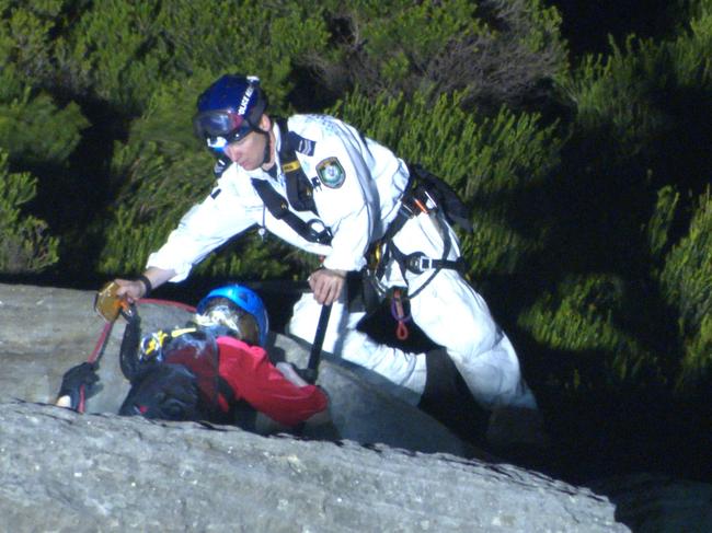 Emergency crews head down the cliff to reach the man, who died from significant head injuries. Picture: OnScene Bondi