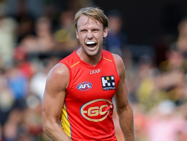 GOLD COAST, AUSTRALIA - MARCH 09: Jack Lukosius of the Suns celebrates a goal during the 2024 AFL Opening Round match between the Gold Coast SUNS and the Richmond Tigers at People First Stadium on March 09, 2024 in Gold Coast, Australia. (Photo by Russell Freeman/AFL Photos via Getty Images)