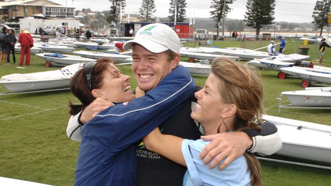 Tom Slingsby is congratulated by his sisters Alana and Jess after winning the World Laser Championship at Terrigal in 2008.