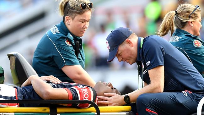 Daniel Tupou was helped from the field with a neck injury. Picture: Getty Images