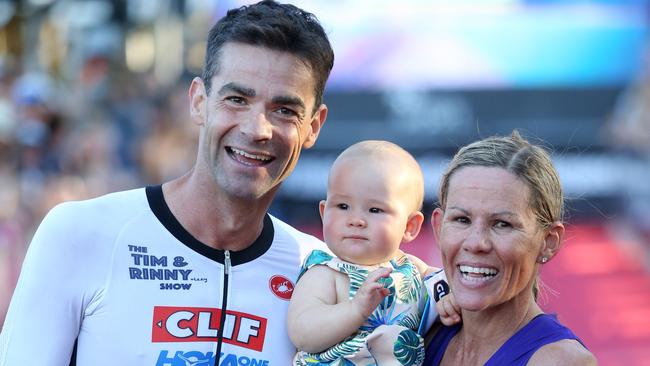 Triathlon super couple Tim O'Donnell and Mirinda Carfrae at the Cairns ironman earlier this year with daughter Isabella.