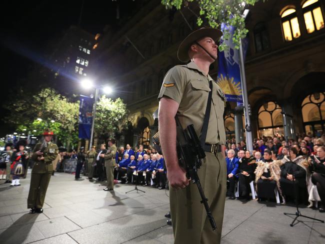 In memoriam ... Soldiers and the public gather for the dawn service at Martin Place Cenotaph for the 100th Anzac Day. Picture: Craig Greenhill